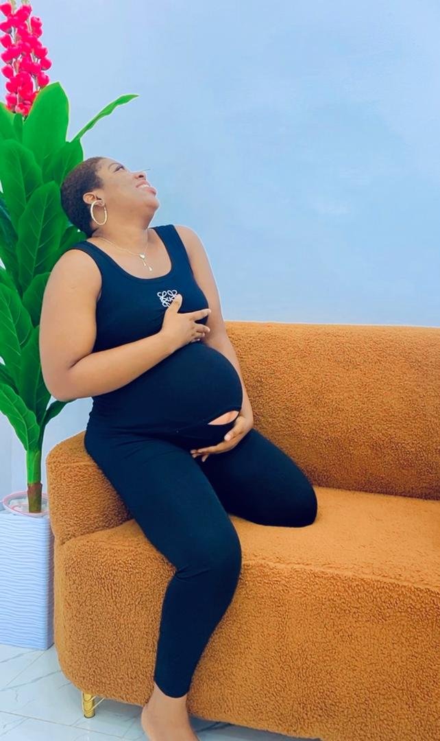 Midwife showing pregnancy guide